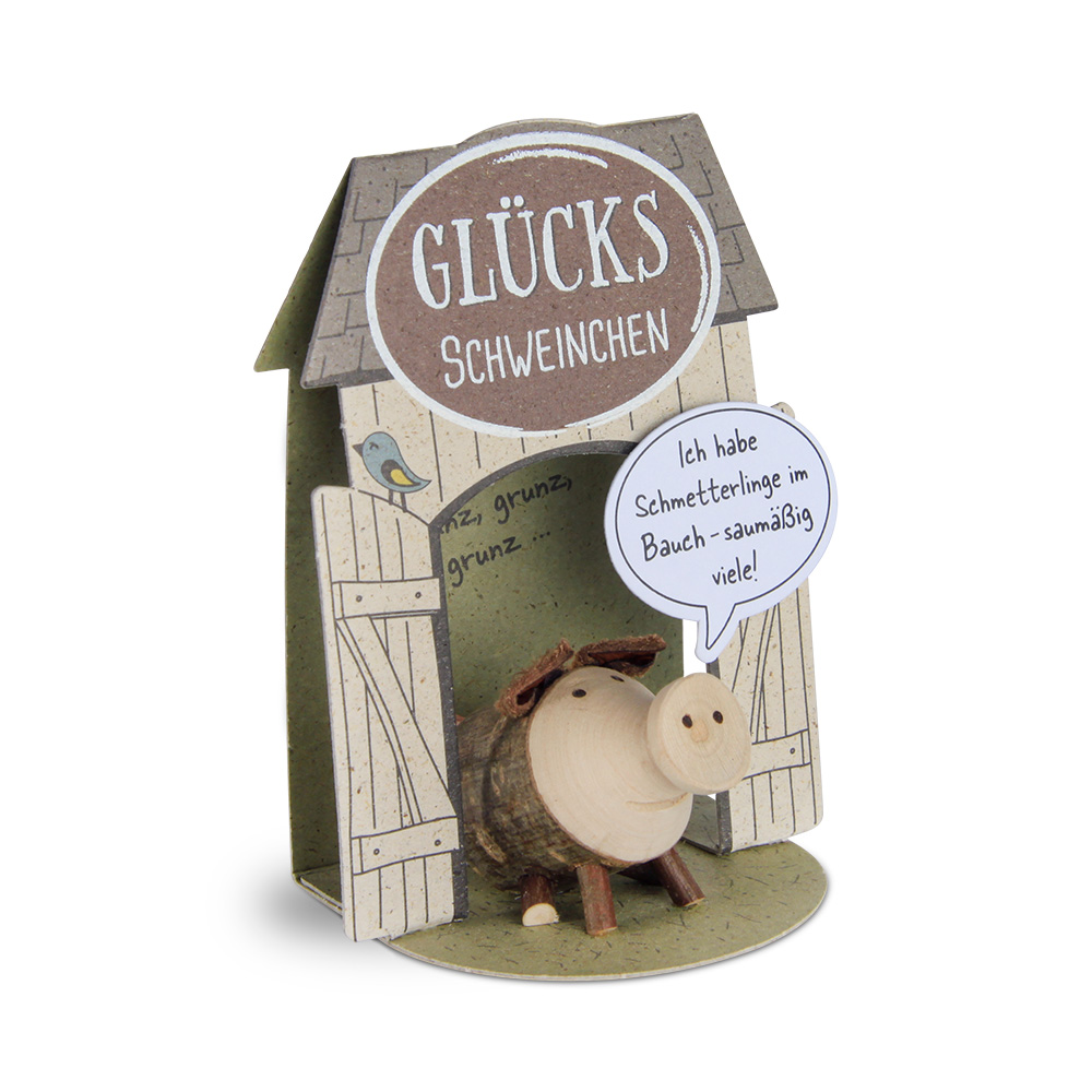 Glücksschweinchen sitzend: "Ich habe…"